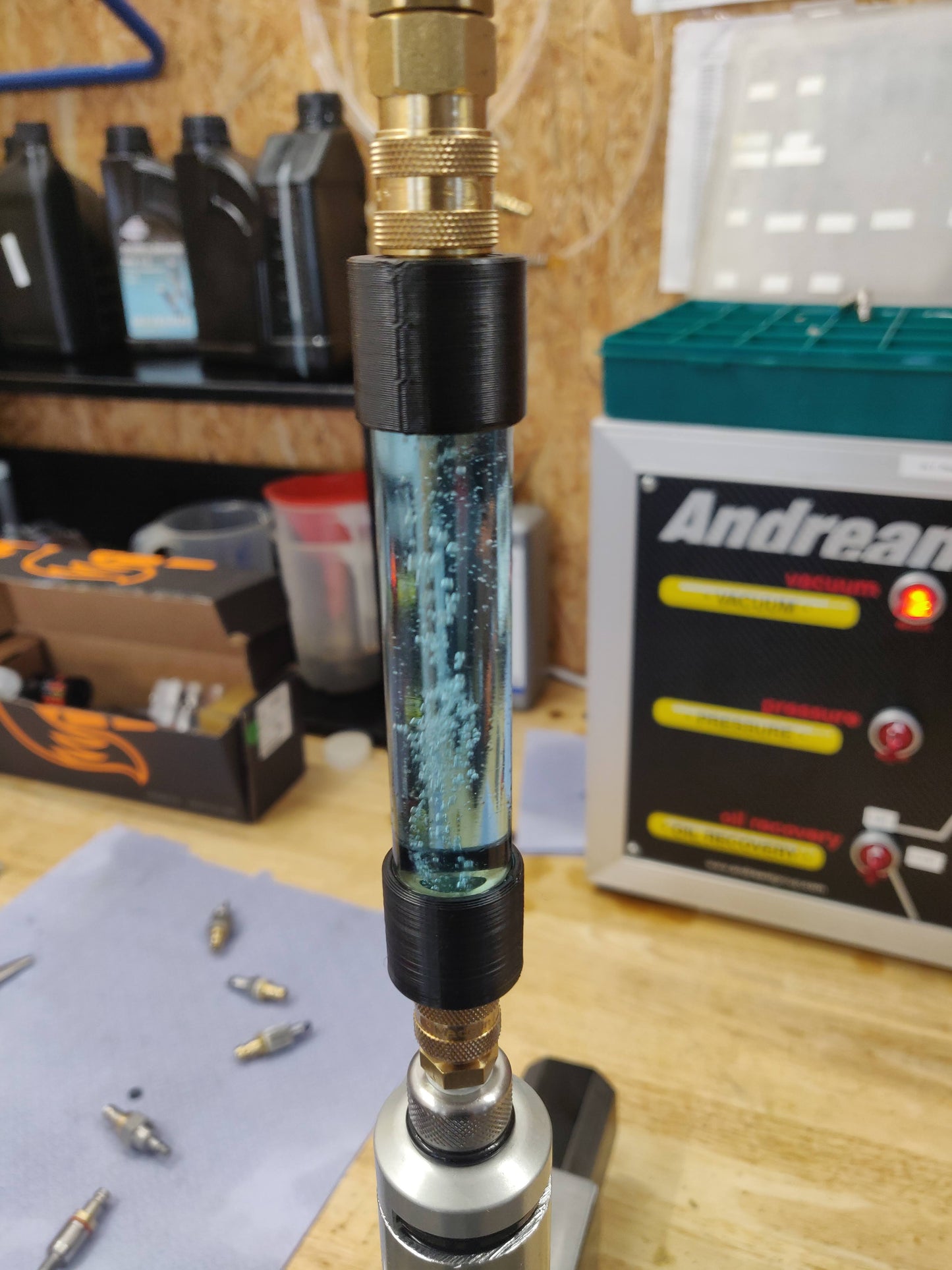 Vacuum bleed mini tank